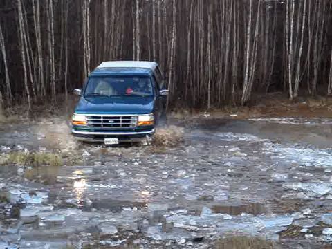 1996 Ford Bronco - This 1996 Ford Bronco navigates a wet, icy path surrounded by trees.