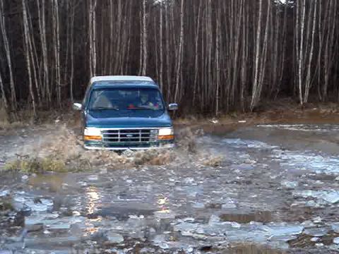 1996 Ford Bronco - This 1996 Ford Bronco is navigating through a challenging watery and icy terrain.