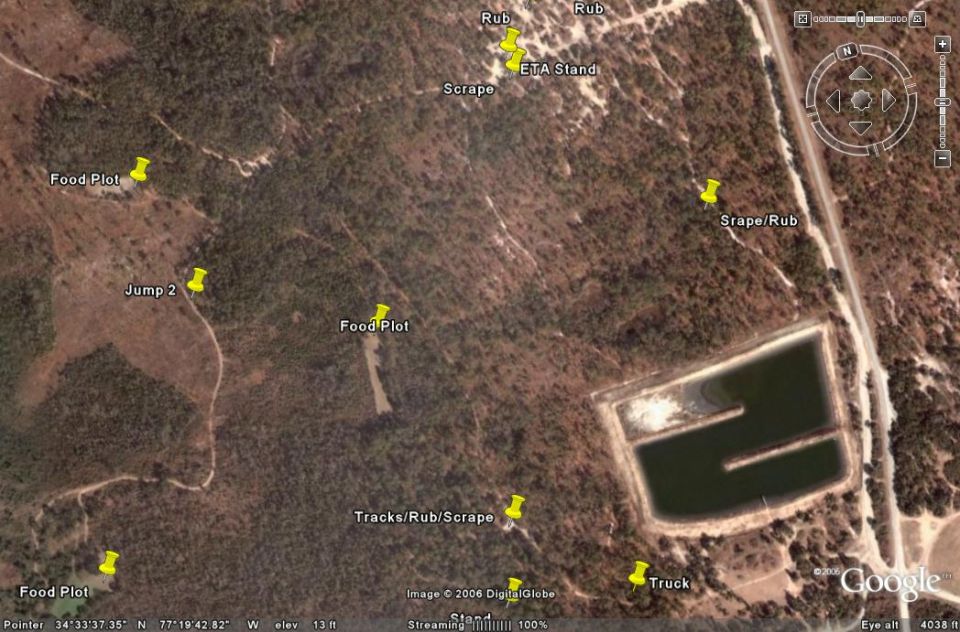 Aerial view of wooded area with a pond, marked with yellow pins for food plots, rubs, and scrapes