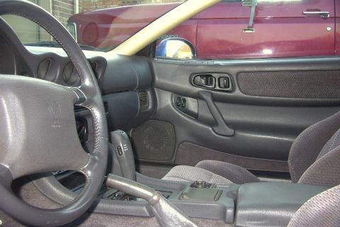 1994 Dodge Stealth - Interior of a 1994 Dodge Stealth, with another vehicle visible outside.