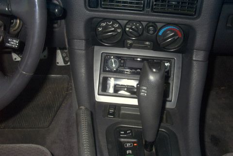 1994 Dodge Stealth - The interior of a 1994 Dodge Stealth, the dashboard, steering wheel, and center console.