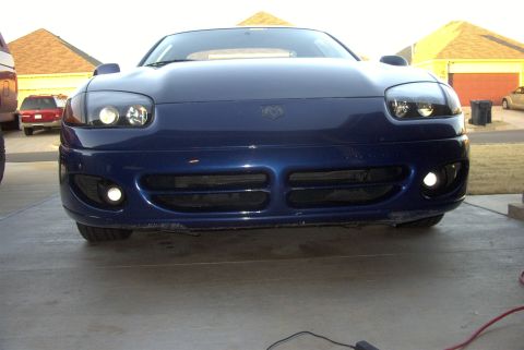 1994 Dodge Stealth - The front of a blue sports car is shown, its distinctive grille and lighting elements.