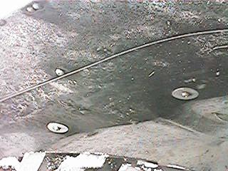 1986 Ford Bronco - Up inside drivers side wheelwell above tire