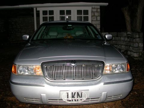 1998 Mercury Grand Marquis - Front view of a silver 1998 Mercury Grand Marquis, its distinctive chrome grille and headlights.