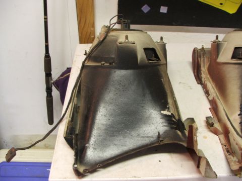 1965 Ford Mustang - A used automotive headlight housing is shown, with visible wiring and mounting points.