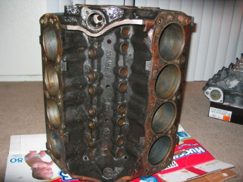 1991 Ford Bronco - A used engine block sits on a surface, showing signs of wear and tear.