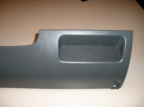 1993 Ford Bronco - Dashboard trim panel with a storage compartment, likely from an older vehicle.