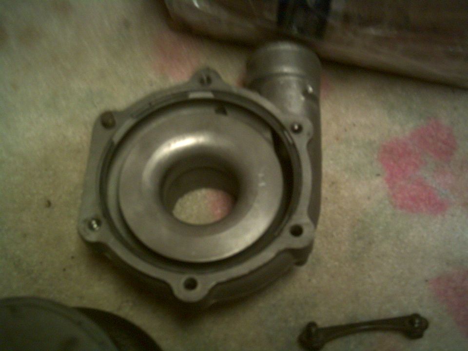 Metal turbocharger housing with a circular intake and outlet pipe