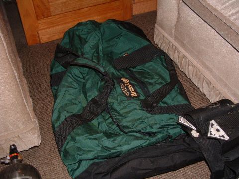 1984 Ford Bronco - A green duffel bag and a paintball tank are visible on the carpeted floor.