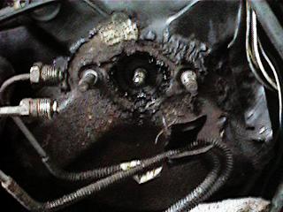 1986 Ford Bronco - Close-up view of a vehicle's master cylinder and brake booster assembly, showing wear and tear.