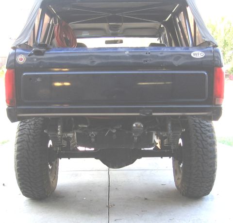 1994 Ford Bronco - This Ford Bronco shows its rear end, modified with aftermarket suspension and large tires.
