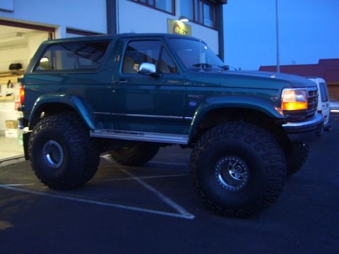 1996 Ford Bronco - This lifted 1996 Ford Bronco is equipped with oversized tires and custom wheels, ready for off-road adventures.