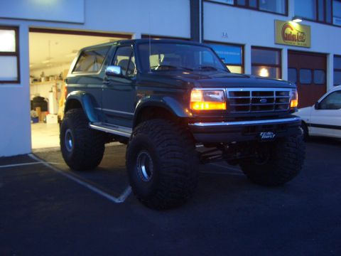 1996 Ford Bronco - This modified 1996 Ford Bronco features oversized tires and a lifted suspension, giving it an imposing stance.