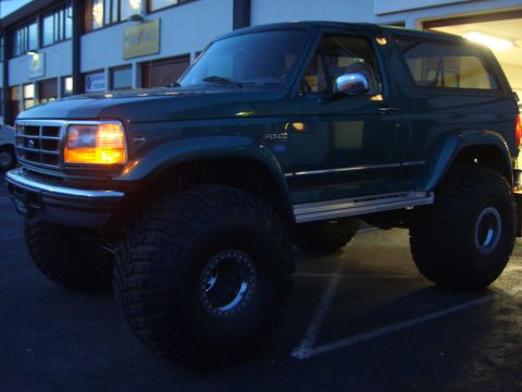1996 Ford Bronco - This 1996 Ford Bronco features large tires and is seen from a 3/4 front angle.