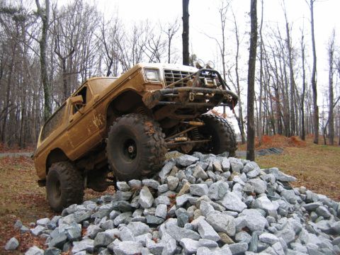 1992 Ford Mustang - This heavily modified SUV is shown navigating a rocky obstacle course.