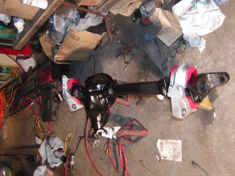 1991 Ford Bronco - Differential axle assembly, likely for a truck or SUV, in a workshop setting.
