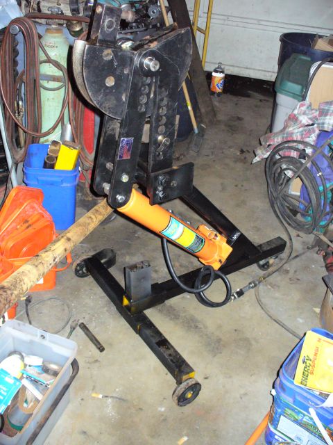 1978 Ford Bronco - A pipe bender is shown in a garage setting with various tools and supplies.