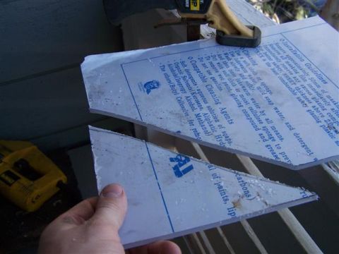 1995 Ford Bronco - Cutting a plastic sheet with installation instructions, with a yellow Dewalt tool visible.