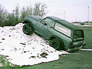 1986 Ford Bronco - This 1986 Ford Bronco is shown attempting to climb a large snow pile.
