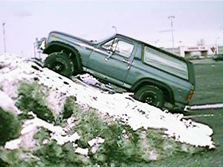1986 Ford Bronco - 1986 Ford Bronco flexing on a snowy hill.