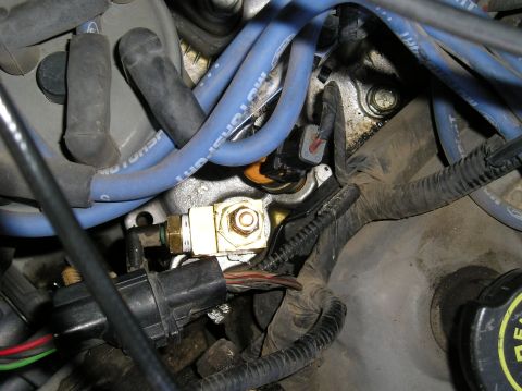 1993 Ford Bronco - Close-up view of engine components, including spark plug wires and sensors.