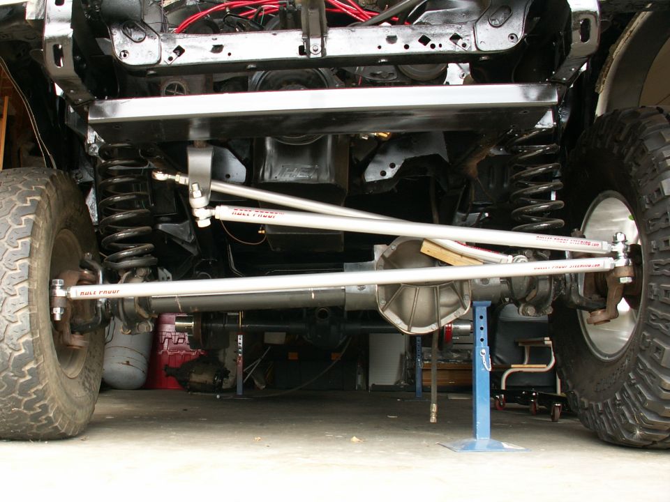 BulletProof Steering from Performance Unlimited....without the track bar drop bracket yet...notice difference of 37inch Pro Comp's on the right of pic, and the original tiny 31inch rubber on left!!