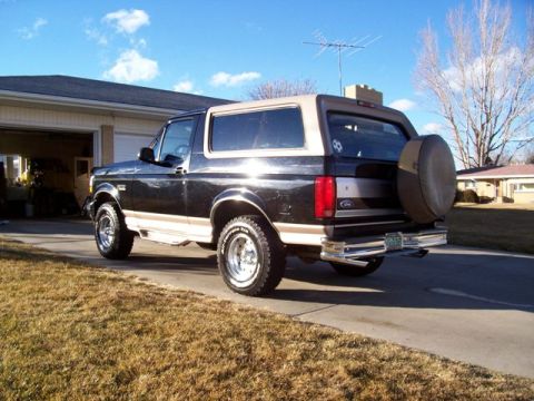 1996 Ford Bronco - This 1996 Ford Bronco is parked outside a suburban garage on a sunny day.