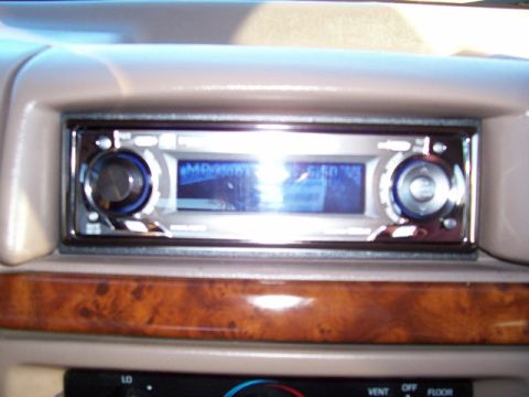 1996 Ford Bronco - Close-up of an aftermarket car stereo unit and dashboard trim.