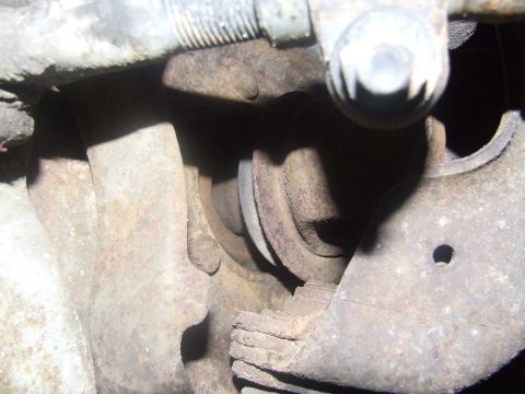 1992 Ford Bronco - This image shows heavily rusted suspension components, not enough detail to identify the vehicle year or model.