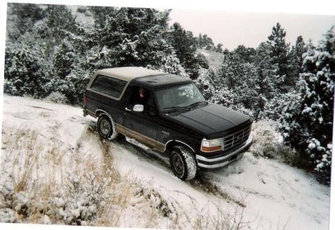 1996 Ford Bronco - This 1996 Ford Bronco navigates a snow-covered trail through a forest.