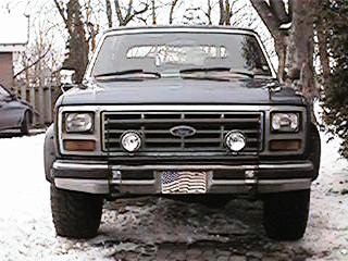 1986 Ford Bronco - Front view of a Ford Bronco from the early 1980s, equipped with a pushbar and auxiliary lights.
