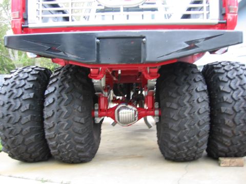 1974 Ford F-100 - This lifted truck features a custom bumper and dual rear wheels on each side.