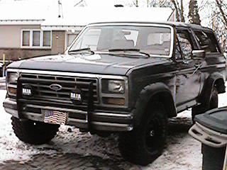 1986 Ford Bronco - This Ford Bronco is equipped with a pushbar and auxiliary lighting, seen in a snowy outdoor setting.