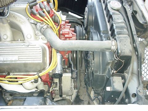 1958 Ford Custom Coupe - Close-up view of a V8 engine bay, showing the radiator and fan assembly.