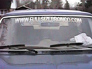 1986 Ford Bronco - Windshield view of a 1986 Ford Bronco, a prominent website banner and Supermotors logo.