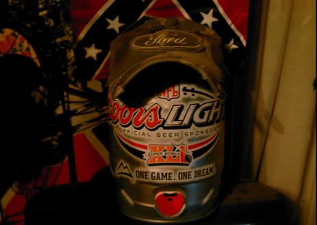 1986 Ford Bronco - A modified beer can helmet with Ford branding and Coors Light logos is displayed.