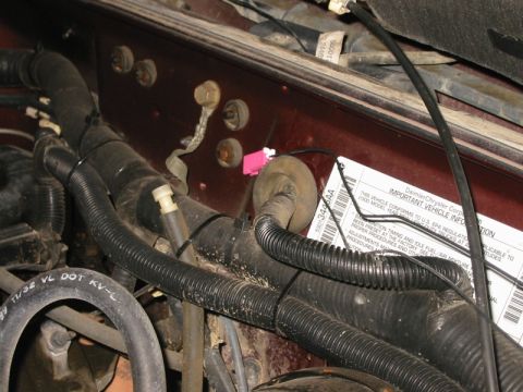 2000 Jeep Cherokee - Detail showing the routing of the antenna lead through the grommet that carries the wiring for the wiper motor from the engine bay to the c…