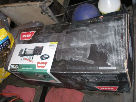 1984 Ford Bronco - Boxed Warn 16.5ti winch, a heavy-duty electric winch for off-road vehicles.