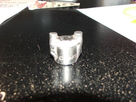 1965 Ford Mustang - A socket wrench part, possibly from Craftsman tools, is shown on a dark surface.