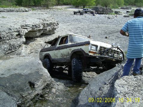 1979 Ford Bronco - This 1979 Ford Bronco is shown off-roading through a rocky stream bed.
