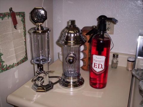 1989 Ford Bronco - Decorative items including a gas pump, fire hydrant, and a bottle labeled 'F.D.' are displayed on a counter.