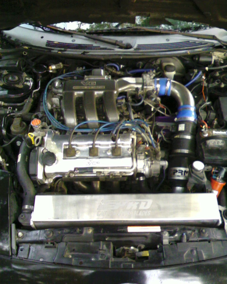 engine bay with V6 engine, intake, and intercooler