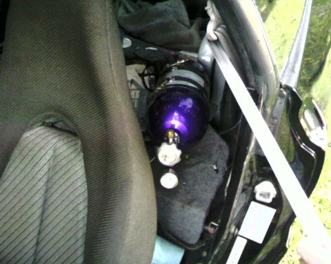 1996 Ford Probe - A purple nitrous oxide tank with gauges is visible inside the vehicle's interior.