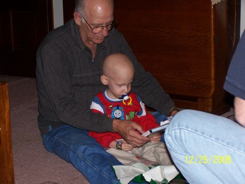 1979 Ford F-150 - Grandfather and child share a moment looking at a book on Christmas day, 2006.