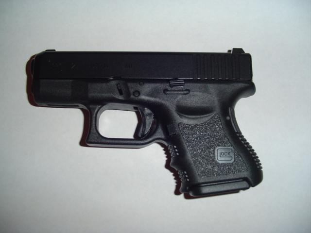 Black handgun with "GLOCK" logo on grip