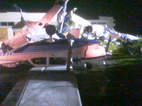 1989 Ford Bronco - Airplane wreckage is visible after an apparent incident, with debris scattered around.