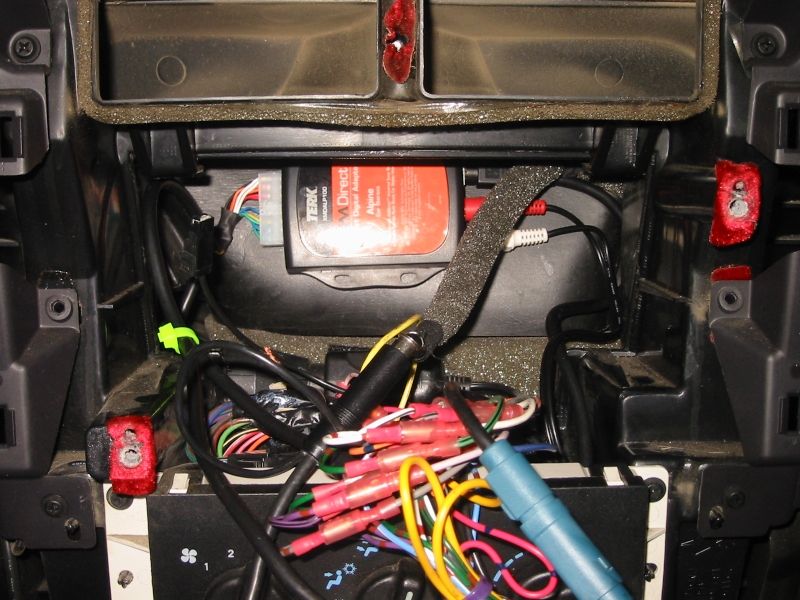 Where the interface box ultimately ended up.  I was trying to avoid using this location if at all possible, but it ended up being the only feasible option.  Note that the audio cables and lead to the tuner just make it.