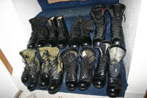 2003 Jeep TJ - Various pairs of combat boots are displayed on a carpeted staircase.