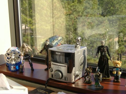 1991 Ford Bronco - Various action figures and a stereo are displayed on a windowsill with a view of trees.