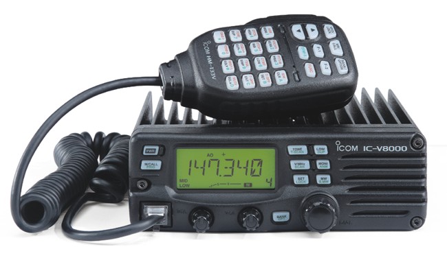 Icom IC-V8000 radio with microphone and coiled cord. Display shows 147.340